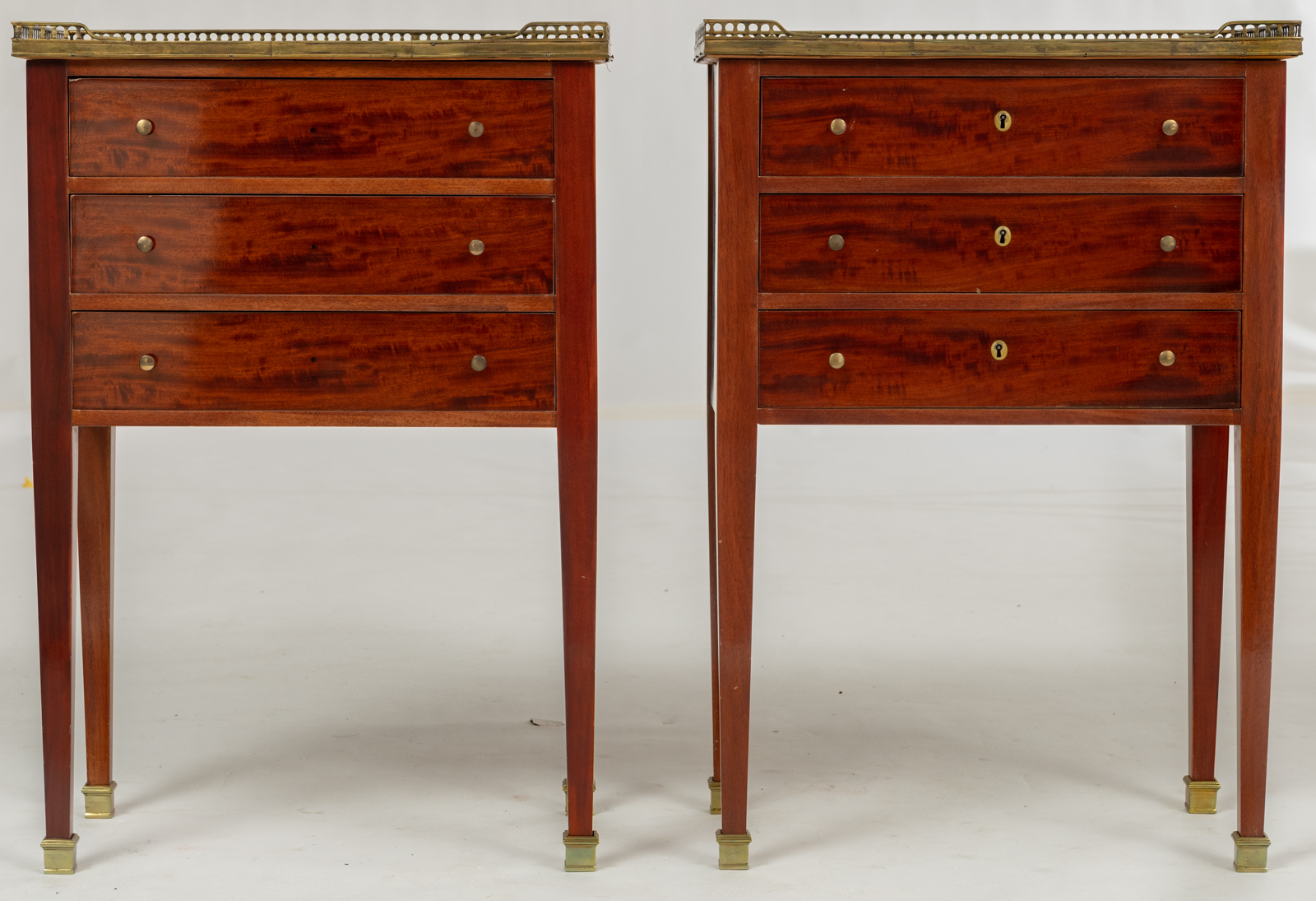 A pair of Neoclassical mahogany veneered side tables, with brass mounts and a gris Ste Anne marble t - Image 2 of 8