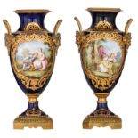 A fine pair of bleu royale ground Sèvres vases with gilt bronze mounts, the roundels polychrome deco