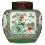 A Chinese famille verte floral pot and cover, decorated with flowers and butterflies, the hardwood c