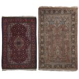 Two Oriental woollen rugs decorated with geometric motifs, 104 x 154 cm / 120 x 180 cm