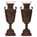 A pair of Neoclassical patinated bronze flower vases on a rouge royal marble base and with glass sha