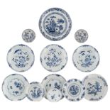 Various Chinese blue and white floral decorated dishes and saucers, 18thC, ø 12 - 28,5 cm
