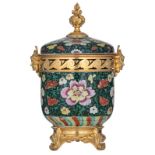 A Chinese black ground famille verte and famille rose floral vase and cover with fine gilt bronze mo