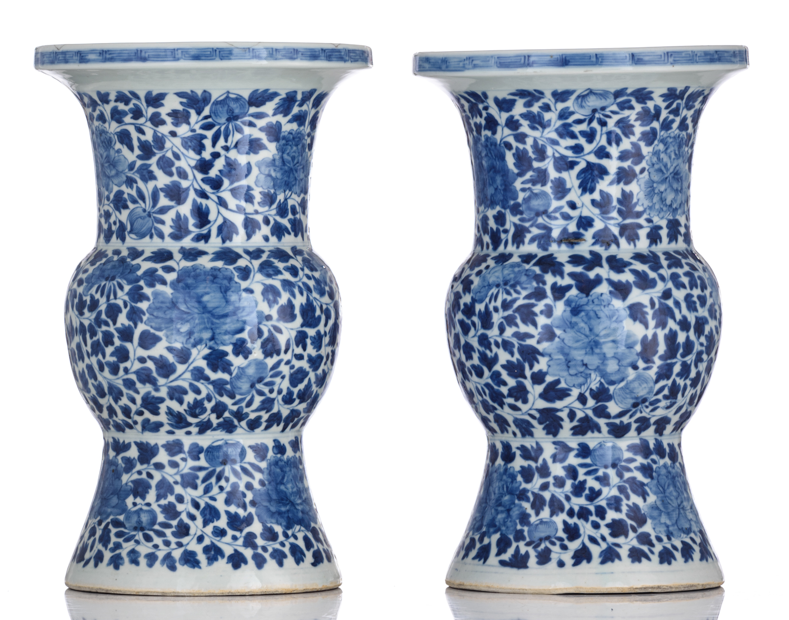 A pair of Chinese blue and white floral decorated Gu vases, 19thC, H 40,5 cm - Image 3 of 6