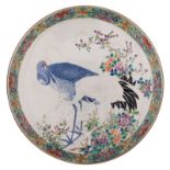 A large Japanese polychrome and relief plate, decorated with herons and flowers, 19thC, ø 47,5 cm