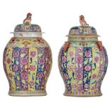 Two Chinese polychrome floral relief decorated vases and covers, 19thC, H 61 - 63 cm