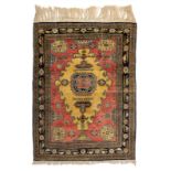 An Oriental silk rug, decorated with geometric motifs and birds, 148 x 104 cm