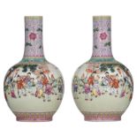 A pair of Chinese Republic period bottle vases, decorated with playing boys, welcoming the spring in