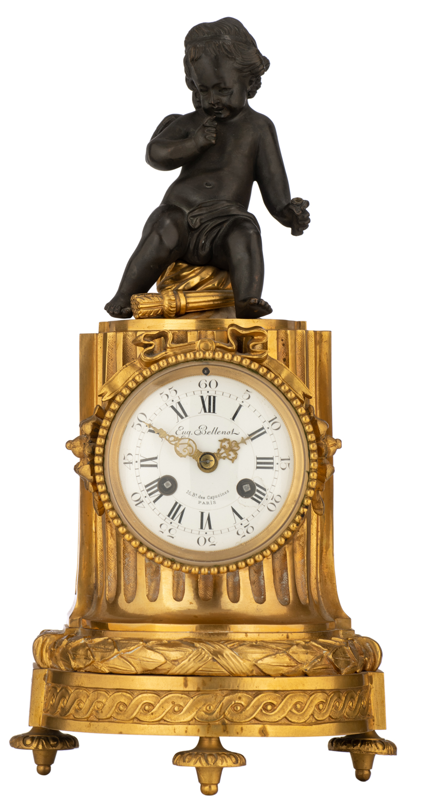 A French column-shaped gilt bronze mantle clock, with a patinated bronze amor on top, the dial marke