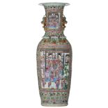 A large and imposing Chinese relief decorated famille rose vase, the roundels with court scenes, 19t