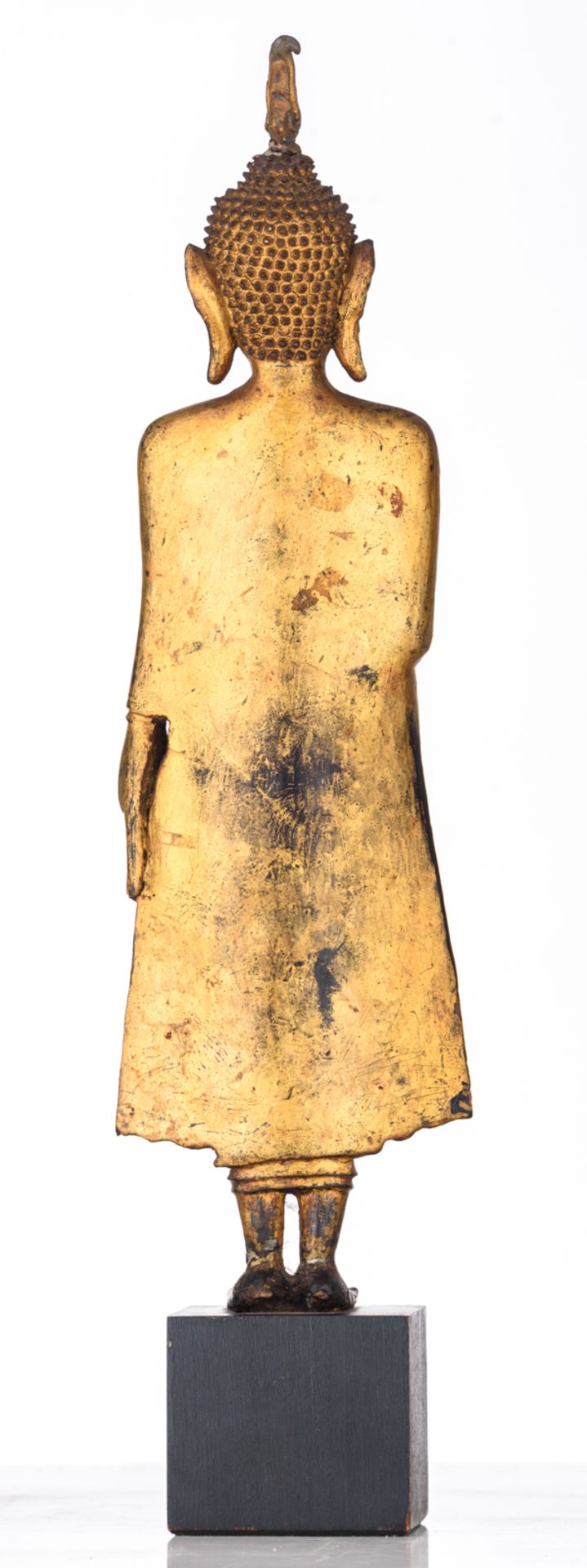 An Oriental gilt decorated bronze figure, depicting a standing Buddha, the raised right hand in abha - Image 4 of 5
