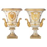 A pair of Limoges porcelain vases, gilt decorated in the Napoleonic manner with an eagle, torches an