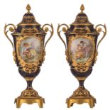 A fine pair of covered bleu royale ground Sèvres vases with gilt bronze mounts, the roundels polychr