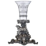 An imposing silver-plated piece de milieu, the base modelled as a pastoral scene with goats frolicki