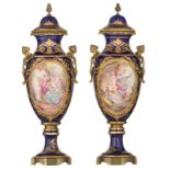 A pair of covered bleu royale ground vases in the Sèvres manner, with gilt bronze mounts, the rounde