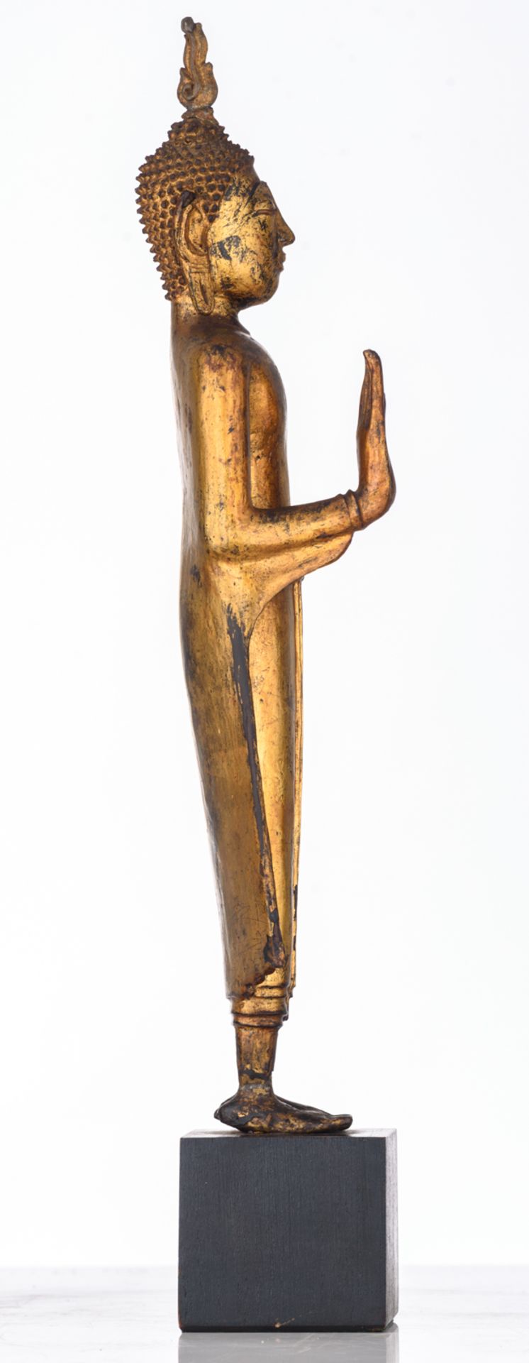 An Oriental gilt decorated bronze figure, depicting a standing Buddha, the raised right hand in abha - Image 5 of 5