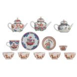 Three Chinese famille rose and polychrome relief decorated teapots, two famille rose cups and saucer