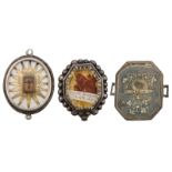 Three 17th / 18thC devotional reliquary pendants with relics of the Holy Cross, St. Francis of Sales