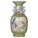 A Chinese lime ground famille rose floral decorated vase, the panels with animated scenes with figur