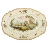 A fine polychrome hand painted plate with a wavy edge, the centre depicting a pastoral scene, the ri