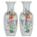A pair of Chinese polychrome vases, decorated with children, waving the banner, the back with callig