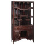 A fine Chinese rosewood display cabinet, decorated with richly carved openwork bandings and brass mo