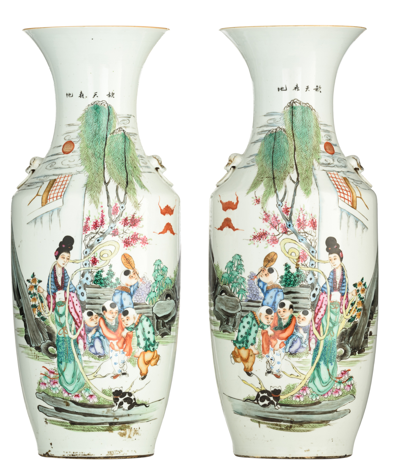 A pair of Chinese famille rose vases, decorated with an animated scene, 19thC, H 57,5 cm