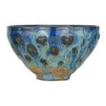 A Jian type bowl, with blue partridge feather alike splashed glaze, H 7 - ø 12,5 cm