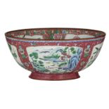 A Chinese pink ground floral decorated email de Canton bowl, the roundels with birds, flowers and pa