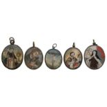Five various smaller oval-shaped devotional reliquary medallions: one portraying St. Benedict on the