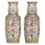 Two Chinese Canton relief vases, the roundels decorated with birds, flowers, butterflies and figures