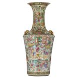 A large and imposing Chinese Canton vase, the roundels decorated with court scenes, the gilt painted