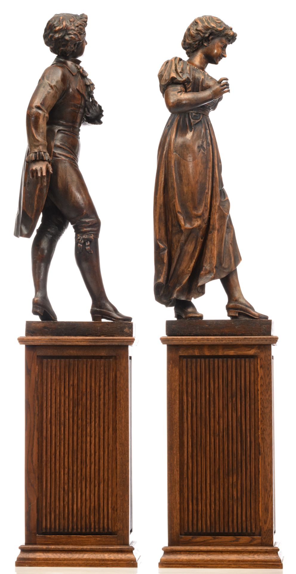 A gallant oak couple on a matching wooden base, early 20thC, H 87 - 147 cm (with base) - Image 4 of 4