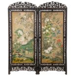 A Chinese richly carved hardwood two-panel screen, the panels decorated with birds and flower branch