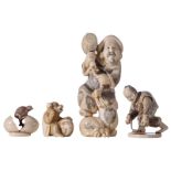 Two Japanese ivory netsuke: one depicting a drum-playing monkey, with stained engraving, signed, H 4