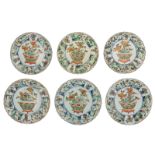 Six Chinese famille verte and gilt lobed plates, decorated with flower baskets and figures in a land