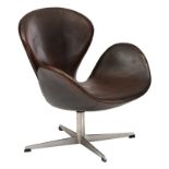 A brown leather upholstered 'Swan chair', design by Arne Jacobsen for the Republic of Fritz Hansen,