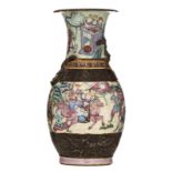 A Chinese famille rose relief decorated stoneware vase, all-over decorated with warrior scenes, 19th