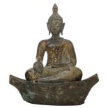A probably Thai seated bronze Buddha on a ditto base, with traces of polychromy, H 24 - W 21 - D 12,