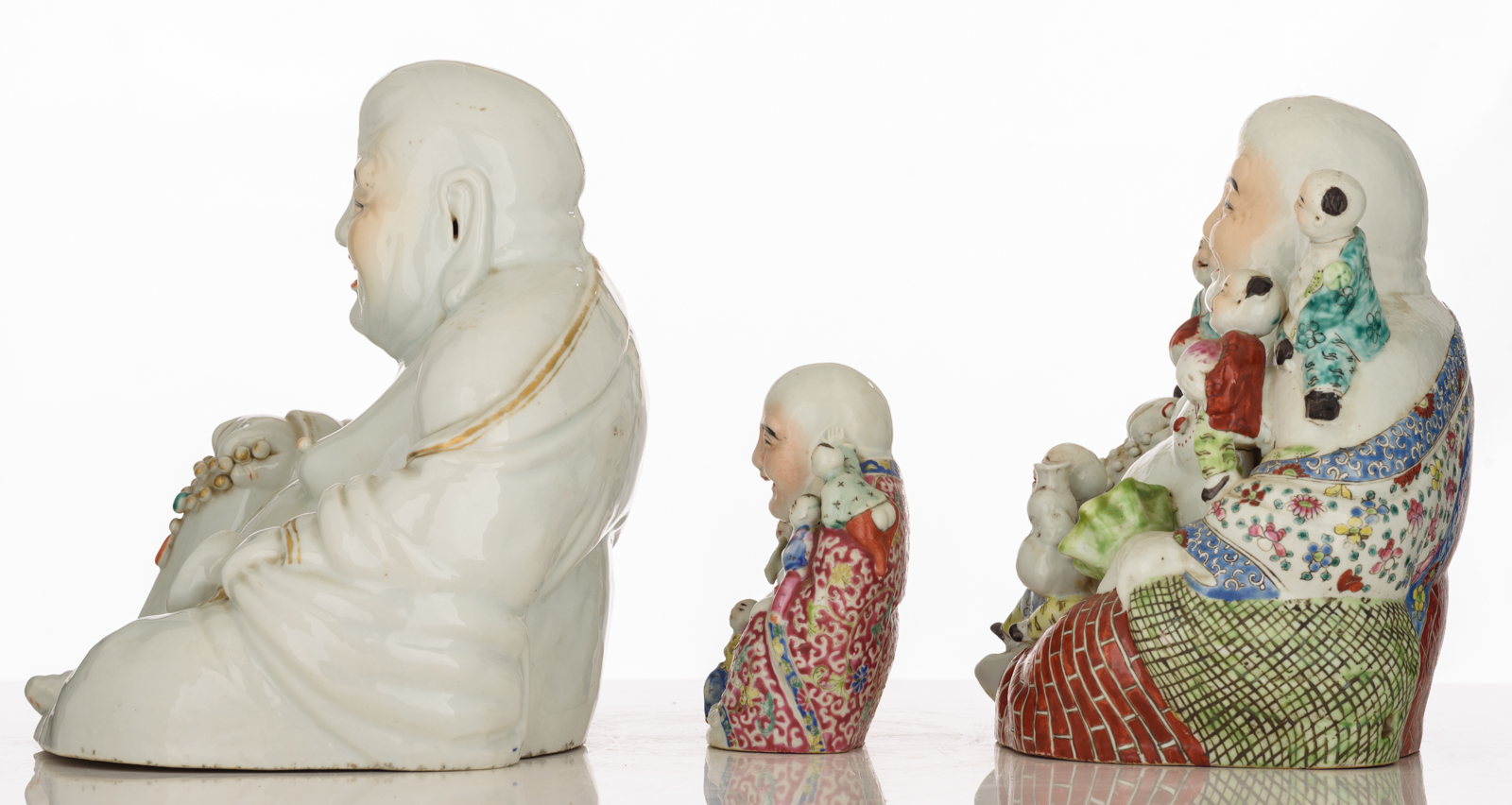 Three Chinese polychrome decorated Budai, two figures holding a chain of praying beads, two figures - Image 2 of 8