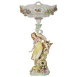 An imposing polychrome painted Saxony porcelain piece de milieu, depicting a beauty with an angel ho