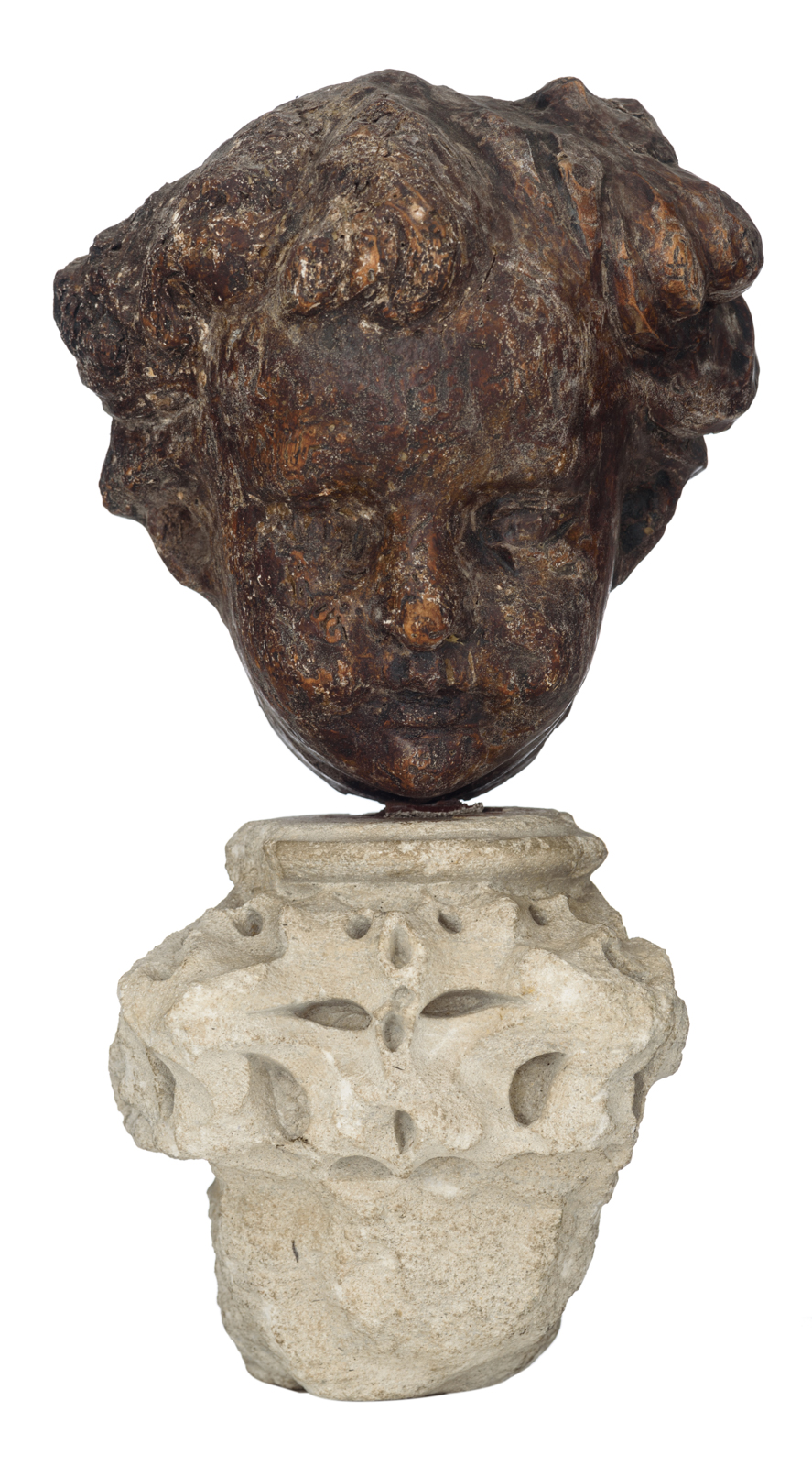 A sculpture of the head of an angel, limewood with traces of polychrome paint, 17thC, the Southern N