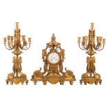 A Neoclassical three-piece gilt bronze garniture, consisting of a pair of candelabras and a mantle c