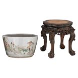 A Chinese polychrome jardiniere, decorated with figures, signed, with a carved wooden base, H 23 - ø