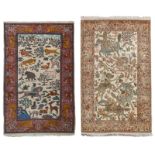 An Oriental woollen rug with hunting scenes 153 x 94,5 cm; added a ditto Indian silk rug, 154,5 x 92