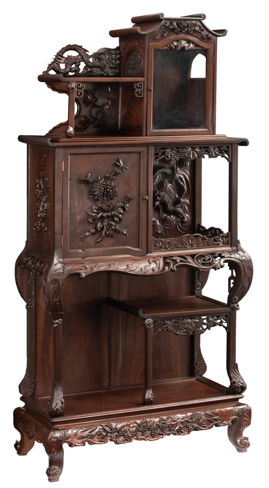 A Chinese inspired exotic hardwood display cabinet, richly sculpted with flowers, bats and dragons,