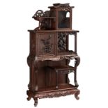 A Chinese inspired exotic hardwood display cabinet, richly sculpted with flowers, bats and dragons,