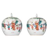 A near pair of Chinese famille rose ginger jars and covers, overall decorated with boys playing in a