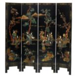 A Chinese fourfold lacquered wooden panel screen, polychrome and gilt decorated with ivory and mothe