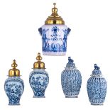 Two pairs of 18thC Dutch Delftware covered vases, with a blue and white chinoiserie decoration, one